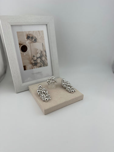 06357 - IMPORTED EARRINGS AND RINGS